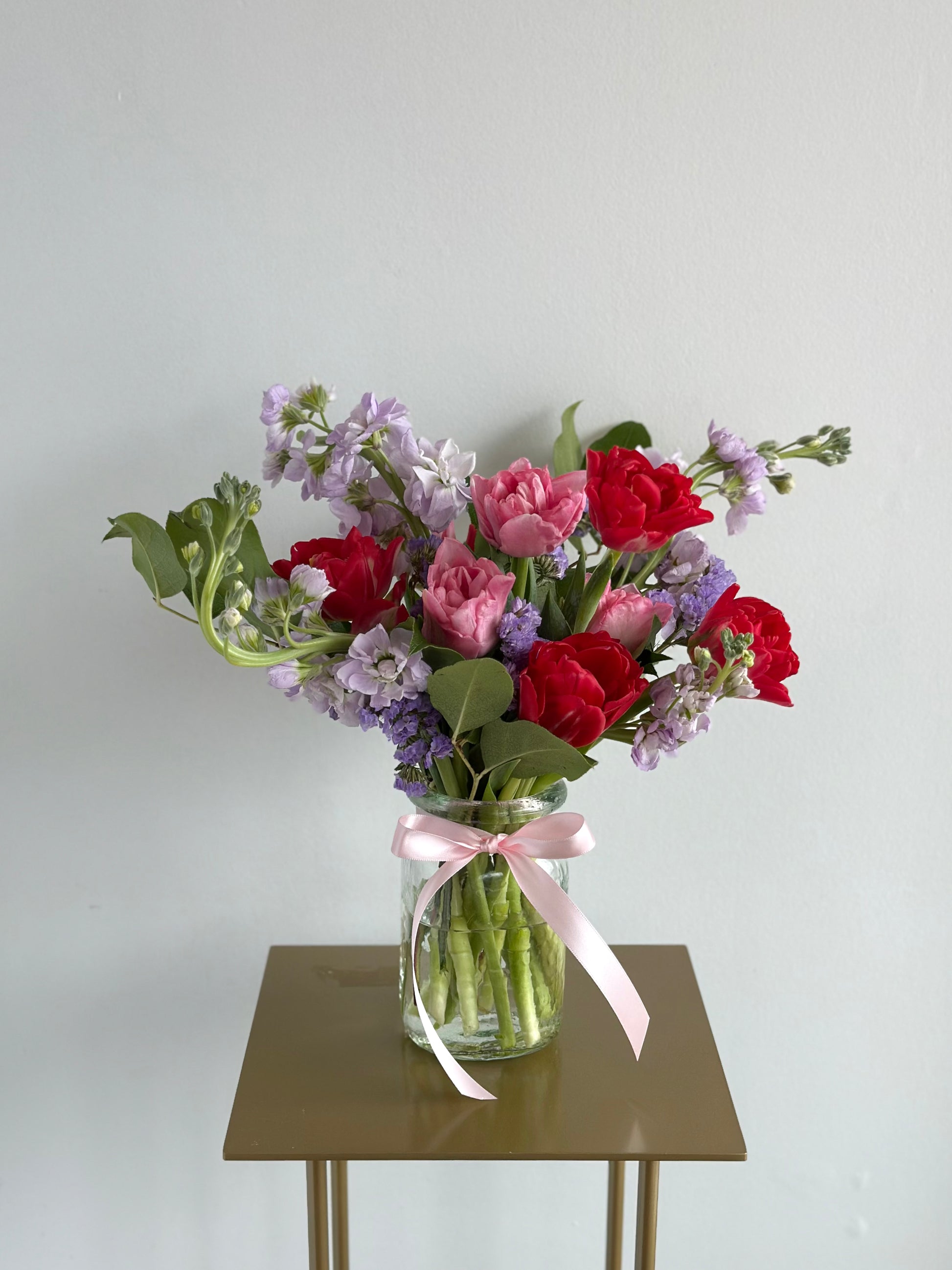 Petite floral arrangement with fresh seasonal blooms, designed in a neutral vase by Fonta Flora Flower Co.