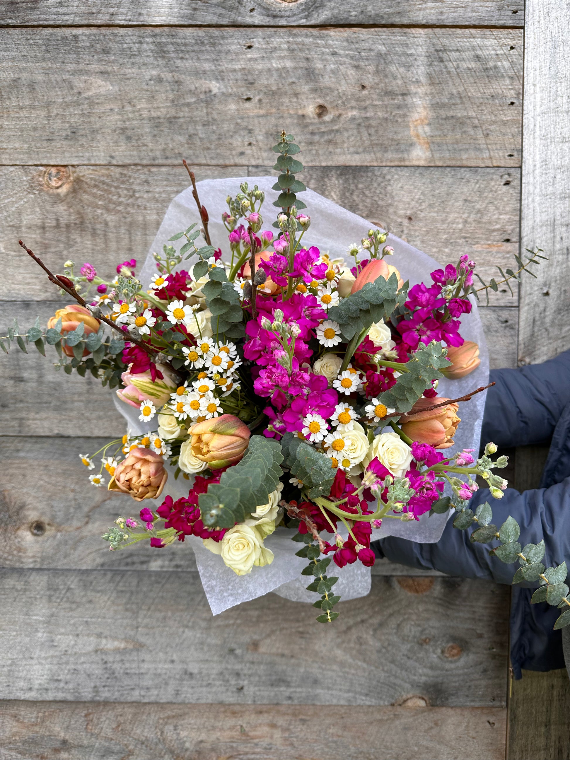 Grand wrapped bouquet with seasonal fresh flowers, hand-tied and wrapped in neutral tissue and brown kraft paper from Fonta Flora Flower Co.