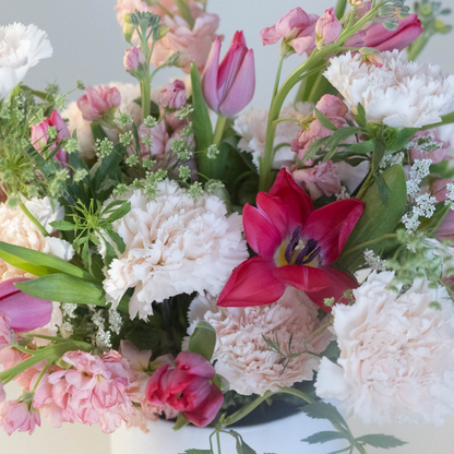 A boutique-style arrangement featuring a mix of seasonal flowers, perfect for Valentine’s Day gifting.